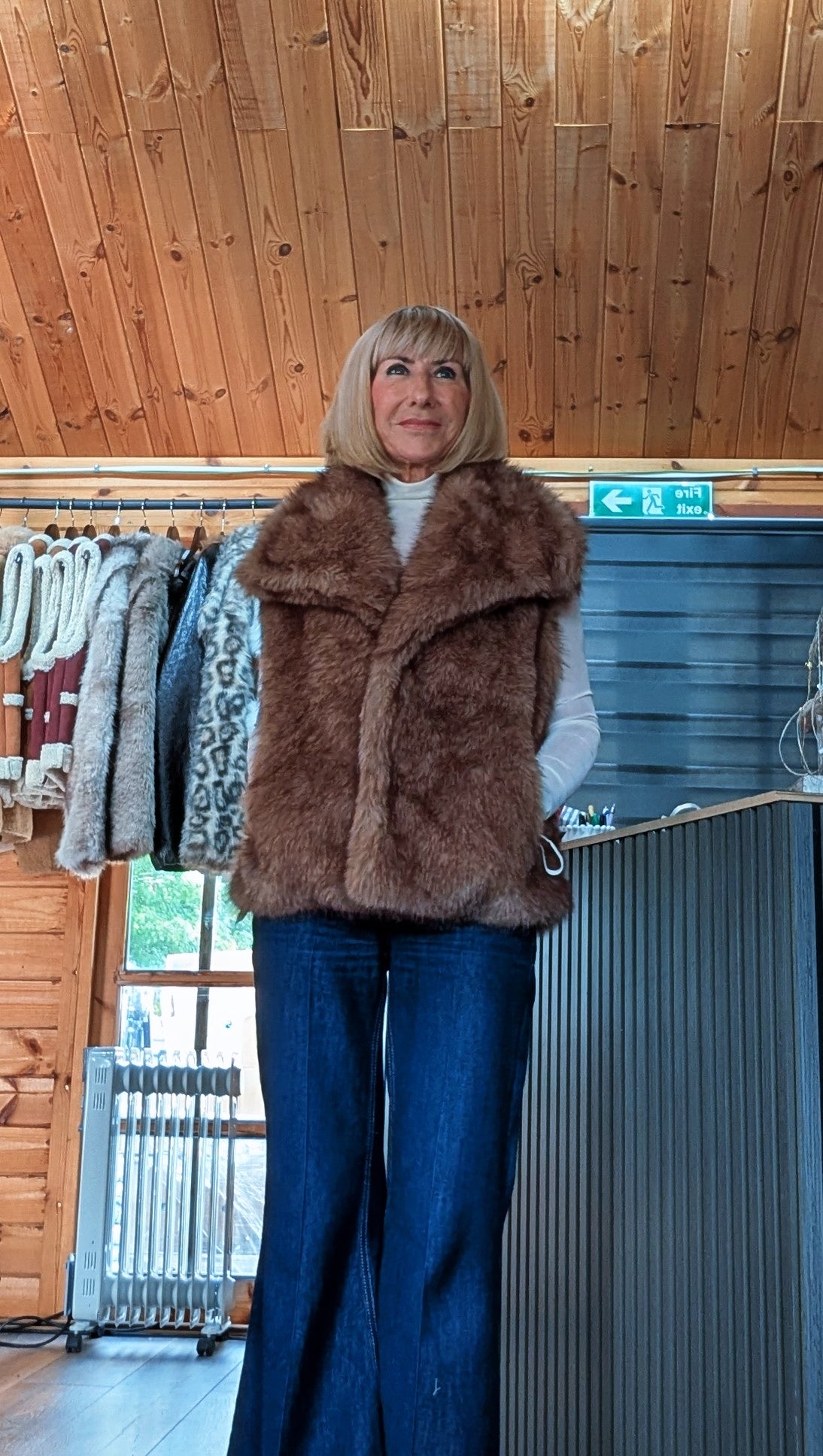 Side view of the Coco chocolate-brown faux fur gilet