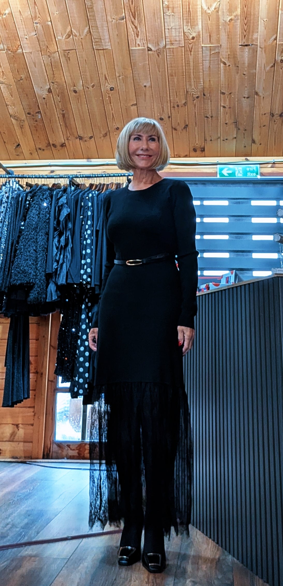 Aoife black lace hem dress styled with black tights and matching shoes