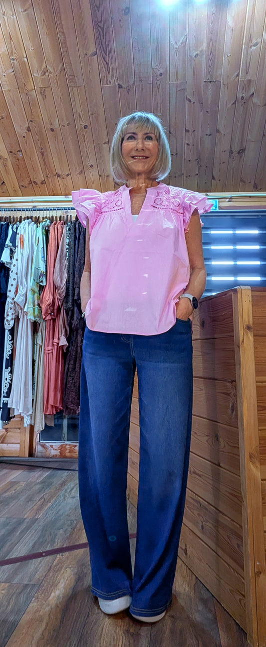 Parker embroidered ruffle blouse styled with jeans
