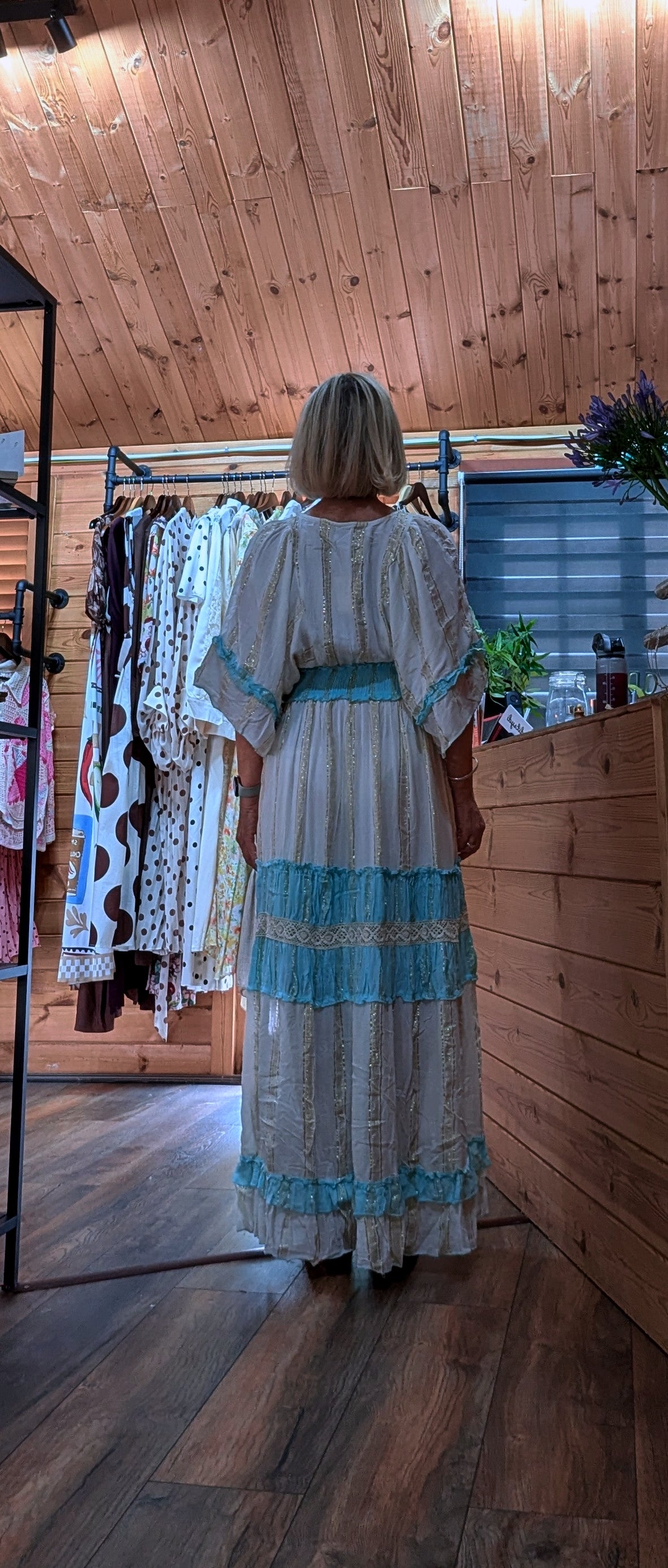 Rear view of the Lucy lightweight viscose maxi dress in a colourful floral print.