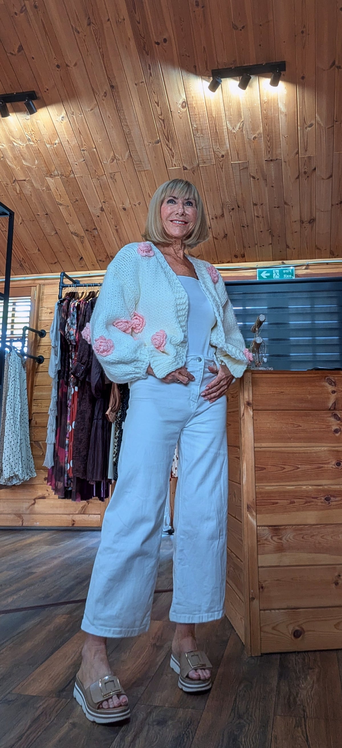Women’s cream chunky knit Rose cardigan with pink crochet flower details