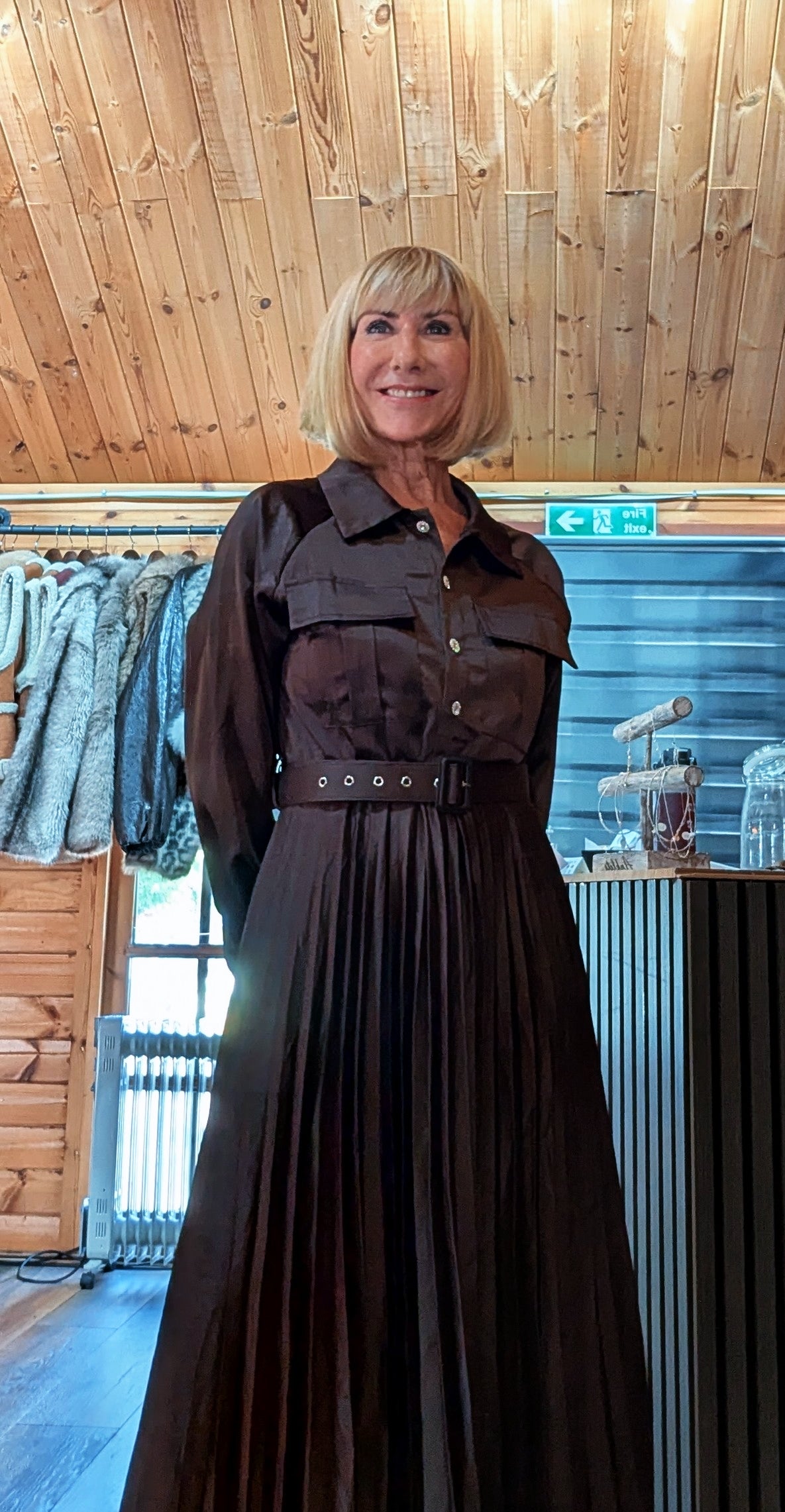Woman wearing the Meryl chocolate maxi dress with a collared button-front bodice

