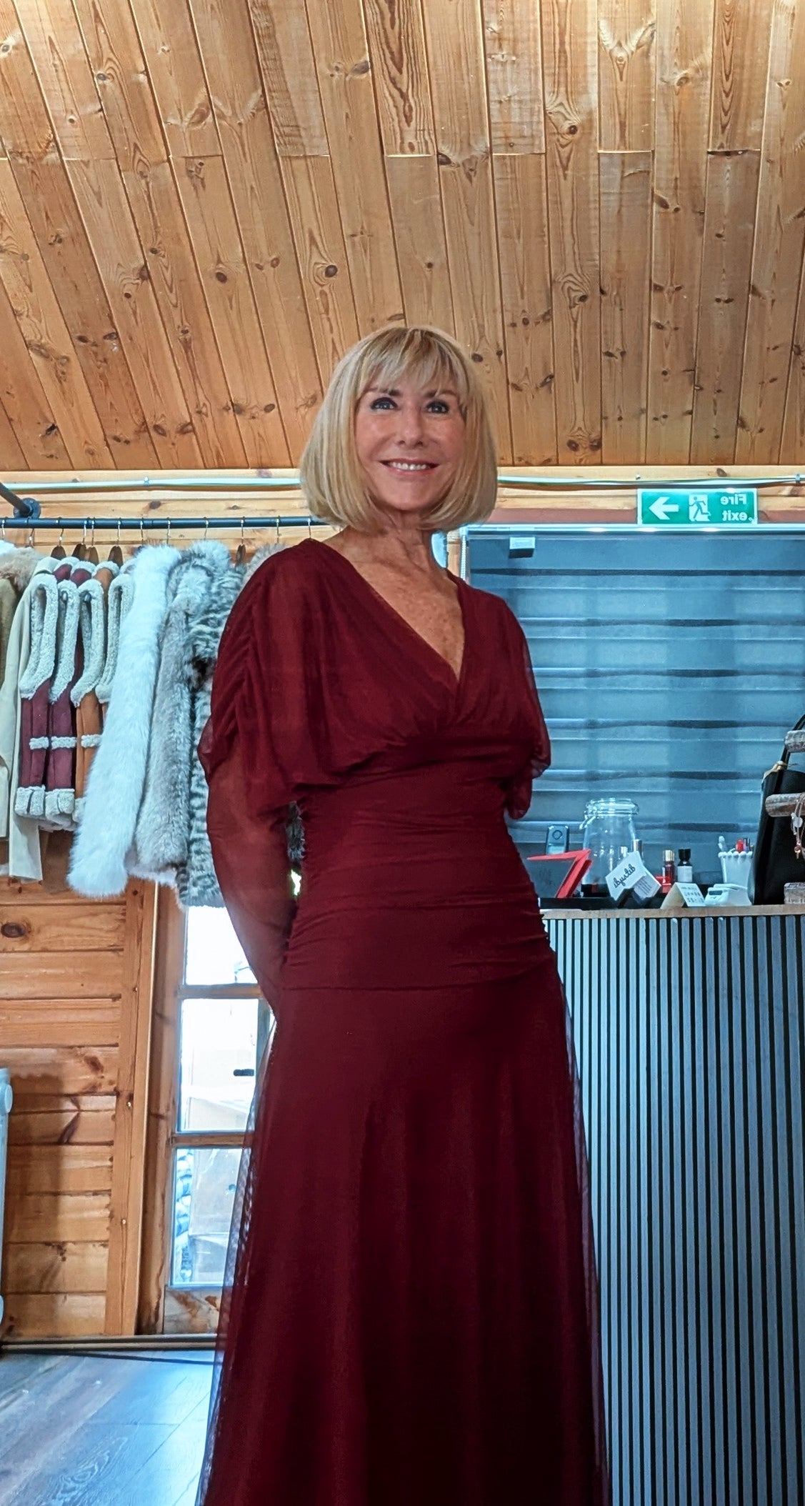 Close view of Luna burgundy dress showing the V-neck bodice and gathered waist detail