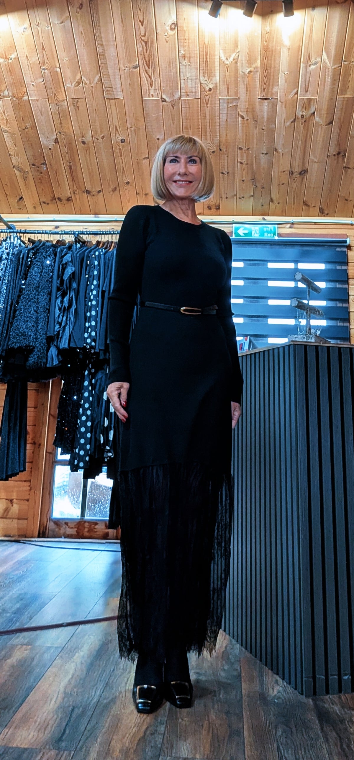 Full front view of the Aoife black belted midi dress and long sleeves